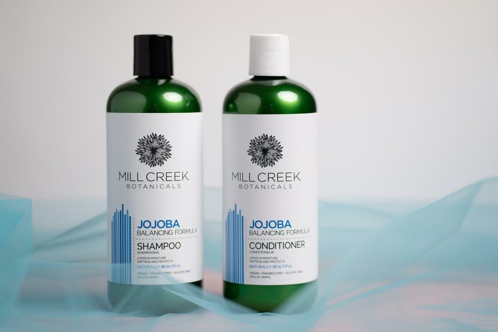 Mill Creek Botanicals Jojoba Conditioner bottle nourishes without weighing hair down.