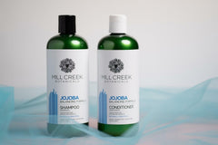 Mill Creek Botanicals Jojoba Conditioner bottle nourishes without weighing hair down.