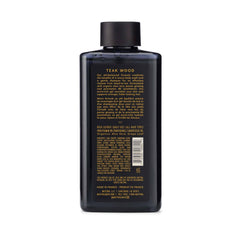 Mistral Teakwood bottle pouring rich lather for shower.