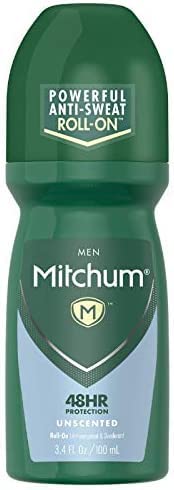 Applying Mitchum Invisible Unscented Roll-On underarm for all-day odor and wetness control.