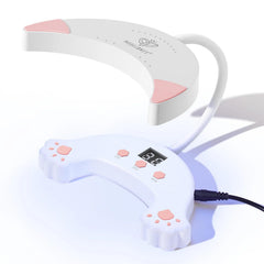 Modelones UV LED Nail Lamp on desk, compact home-use design for quick curing.