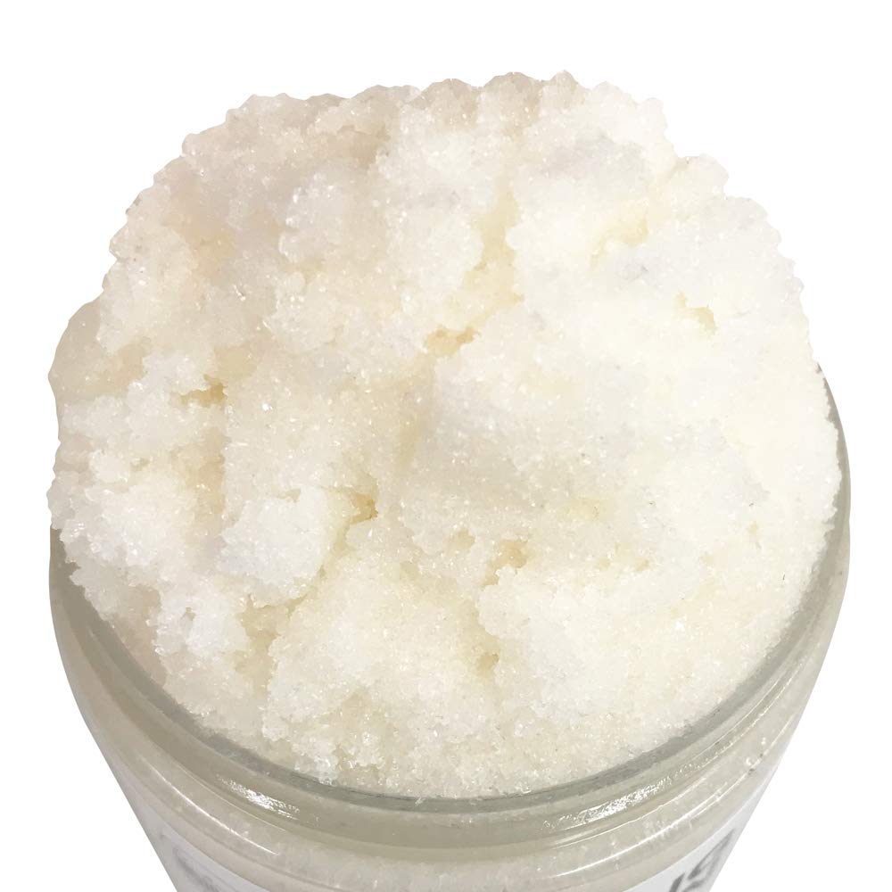 Close-up of fine exfoliating granules in Mojo Spa scrub for delicate exfoliation.