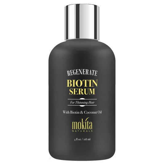 Mokita Naturals Hair Growth Serum bottle close-up highlighting paraben-free biotin for healthier-looking hair.