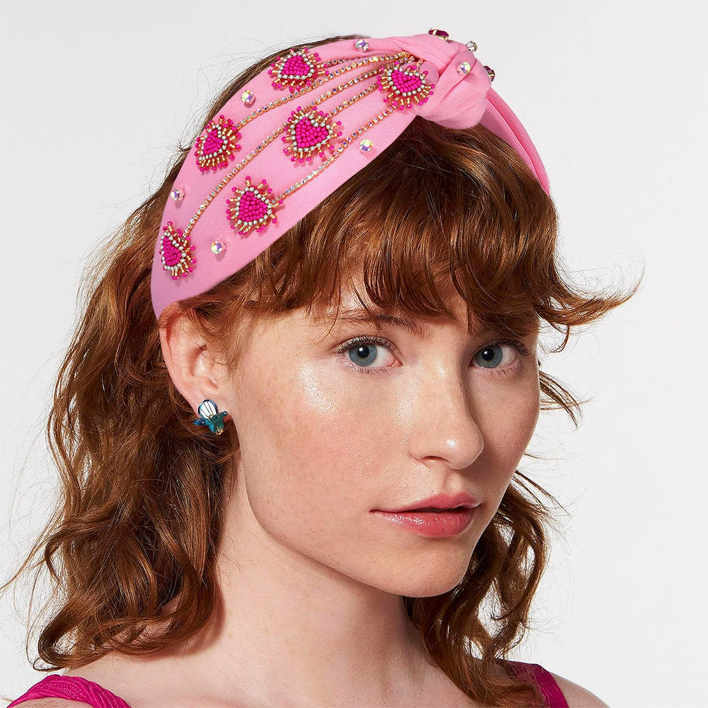 MOLOCH crystal-knotted design highlights a chic, festive look for parties.