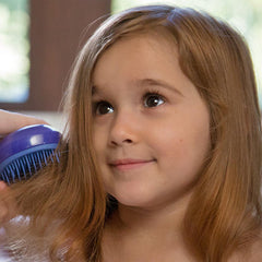 Bath time scene with MONAT Junior Gentle Conditioner and a smiling child