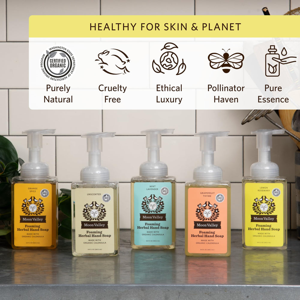 Moon Valley Organics Lemon Rosemary foaming hand soap bubbles in a sink setting