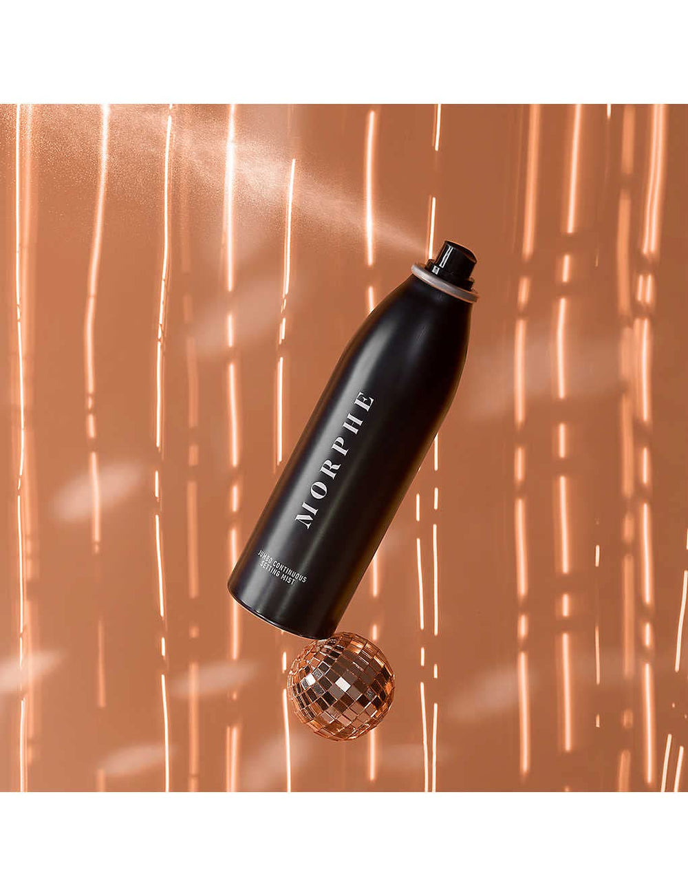 MORPHE Jumbo Setting Mist bottle pour for quick refresh between steps.