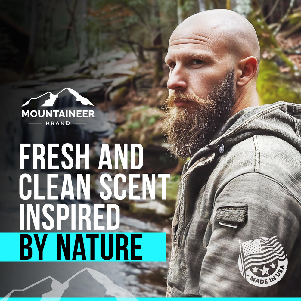Hands applying Mountaineer Brand exfoliator on bald head for a smooth feel.