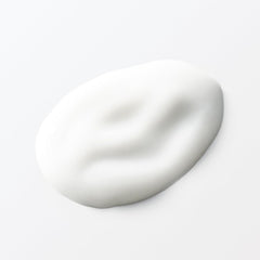 MUJI lotion in soft lighting emphasizes gentle care for delicate skin.