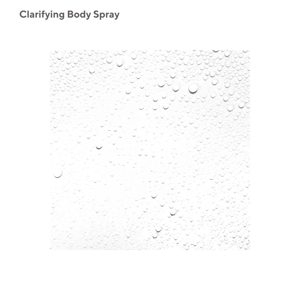 Murad Clarifying Body Spray mist-application shows fine mist for even coverage across shoulders.