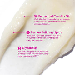 Texture on hand shows Murad Lipid-Enriched Cleansing Balm balm-to-oil transition