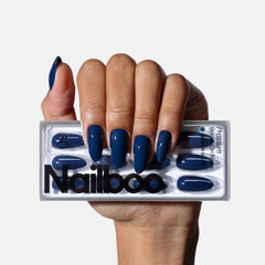 Nailboo Ocean Blue press-on nails on hand for at-home manicure