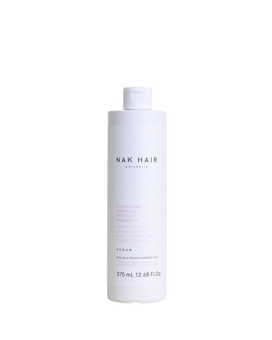NAK Hair Structure Complex Shampoo bottle highlighting strength and hydration for damaged hair.