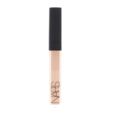 Close-up texture of NARS concealer shows creamy hydration on skin.