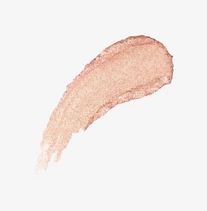 Natasha Denona Hy-GEN Glow Beautifier application on cheekbones for a radiant highlight.