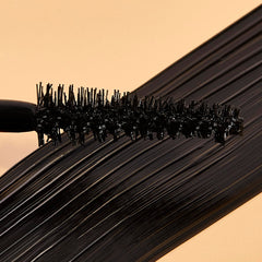 Natasha Moor Moor Power Mascara wand close-up reveals lengthening potential.