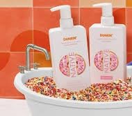 Native Strawberry Frosted Moisturizing Conditioner bottle highlights hydration for silky shine