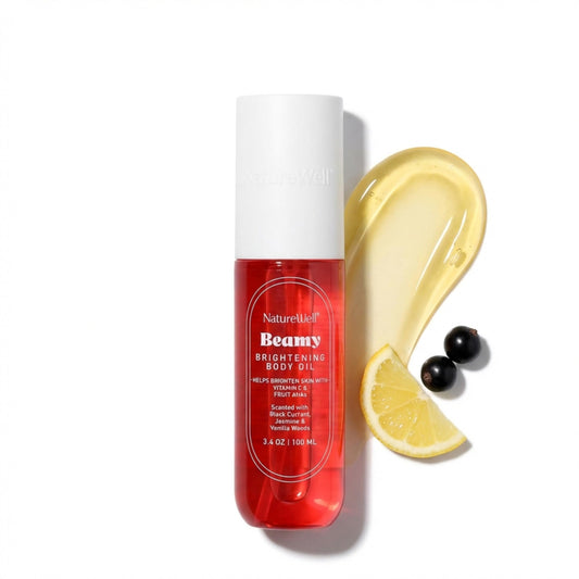 NATURE WELL Beamy Brightening Body Oil bottle pour demonstrates quick absorption and hydration.