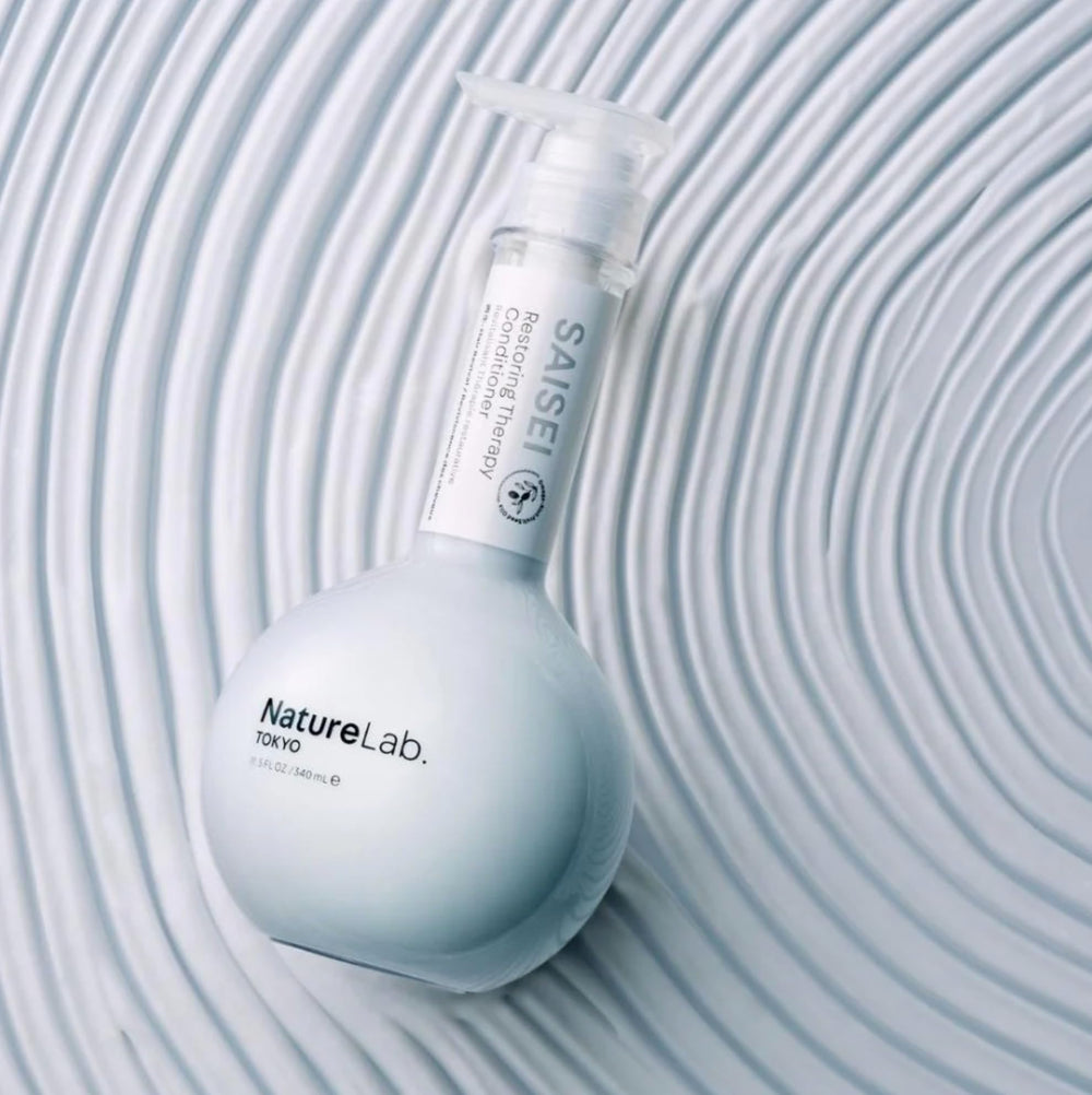 NatureLab.TOKYO SaiSei-treated hair strand appears smoother and more manageable.