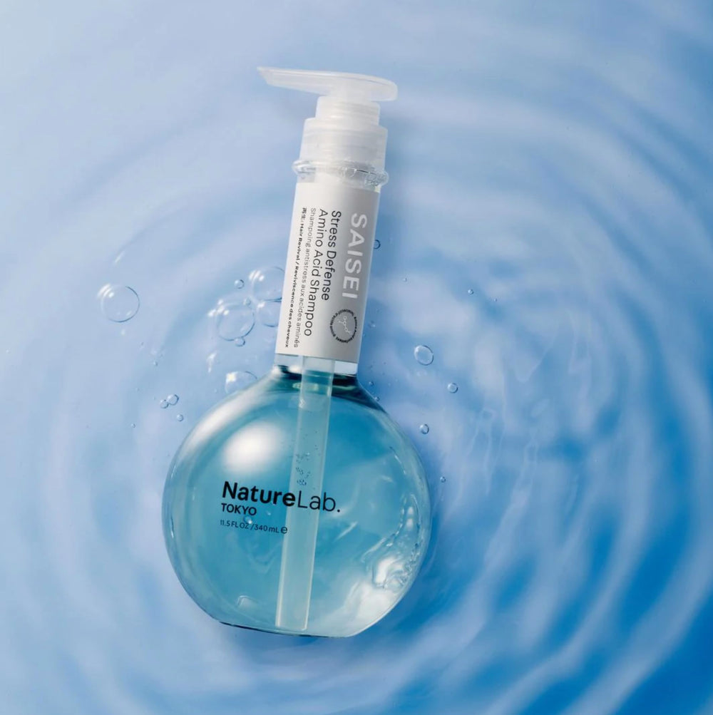 NatureLab.TOKYO SAISEI Stress Defense Amino Acid Shampoo bottle with botanical ingredients graphic
