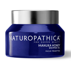Naturopathica Manuka Honey Whipped Oil bottle close-up showing luxurious texture and antioxidant care.