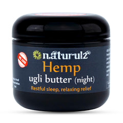 Naturulz Ugli Butter Night Cream bottle on nightstand ready for nightly routine.