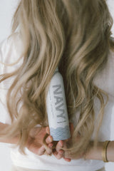 Navy Dry Texture Spray resists humidity for longer-lasting styles.