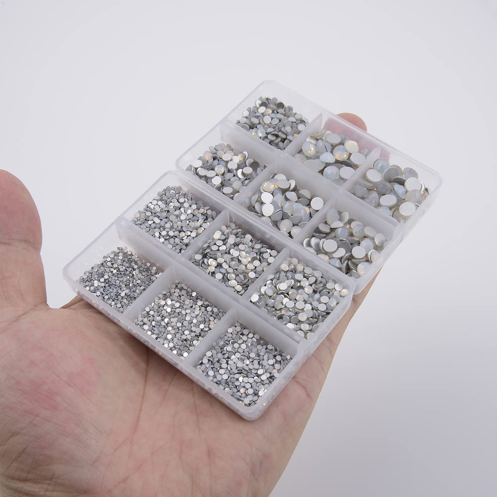 NCB 8000pcs nail art tools with tweezers for easy placement precision.