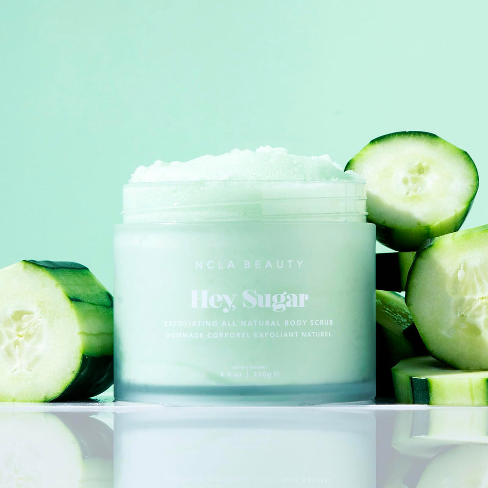 NCLA Beauty Hey Sugar exfoliating sugar particles indicating gentle dead skin removal.