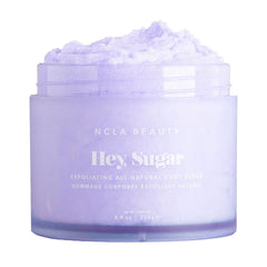 NCLA Beauty Hey Sugar scrub bottle highlights mango butter for moisturized skin.