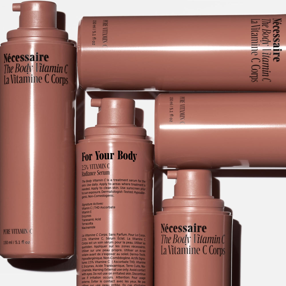 Nécessaire The Body Vitamin C Serum application on arm demonstrating light texture.