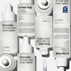 Nécessaire Scalp Serum on dry scalp area, soothing daily care.