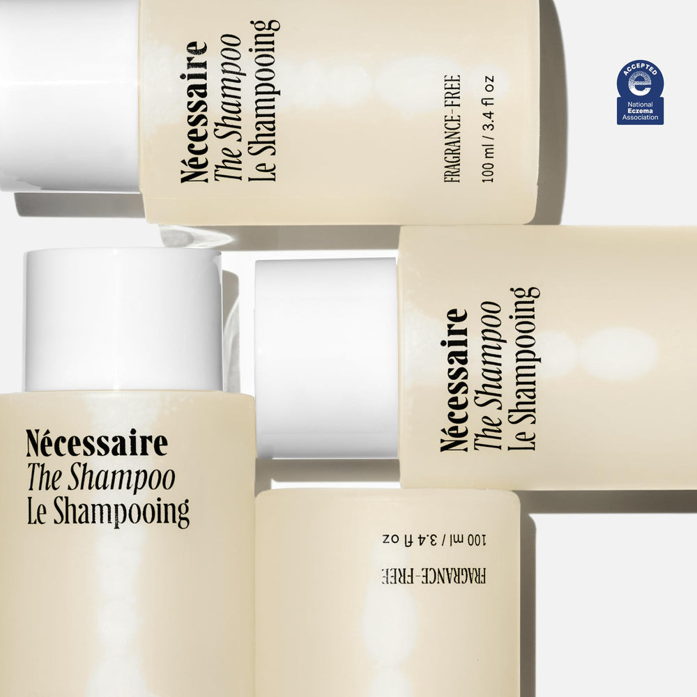 Nécessaire Shampoo Mini bottle back reveals dermatologist-tested, fragrance-free, color-safe attributes.