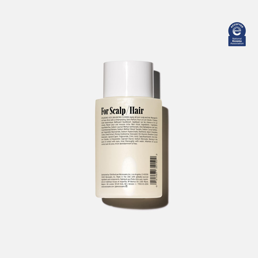 Nécessaire Shampoo Mini bottle side angle highlighting compact travel size for on-the-go routines.