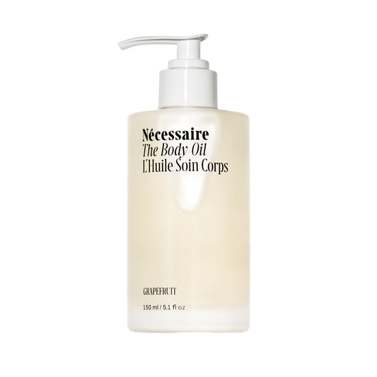Nécessaire The Body Oil bottle pour demonstrates smooth, fast absorption for daily skincare.