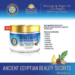 Nefertiti's Secrets Moringa Oil Cream hands applying to damp hair shows easy distribution.