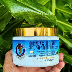 Nefertiti's Secrets Moringa Oil ingredient close-up highlighting nourishing oil benefits for curls.