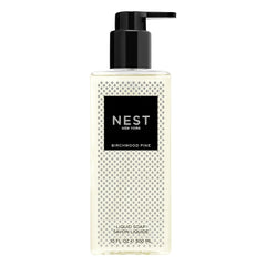 NEST New York Birchwood Pine liquid soap bottle pouring, delivering clean hands with subtle, aromatic notes.
