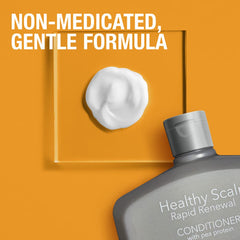 Neutrogena Healthy Scalp conditioner on wet hair for quick absorption.