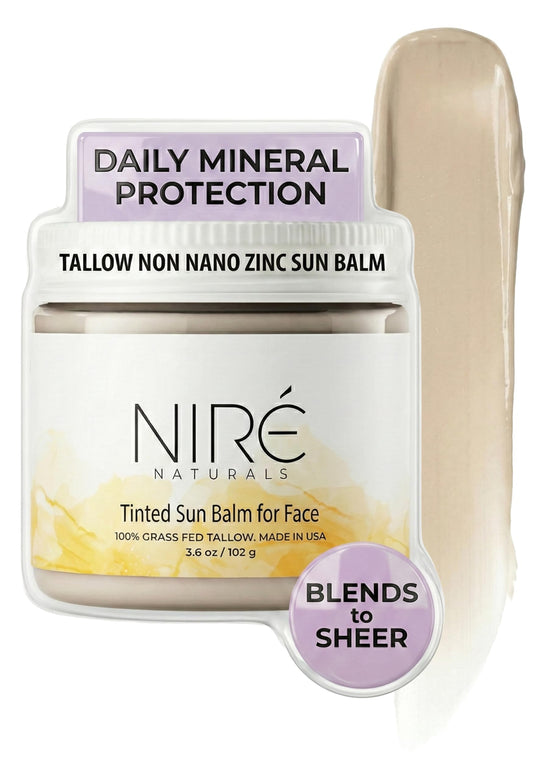 Niré Naturals tinted beef tallow sun balm in a glass jar, eco-friendly packaging and mineral protection.