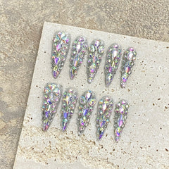 NLSJMP long stiletto almond nails for a polished salon-like finish.