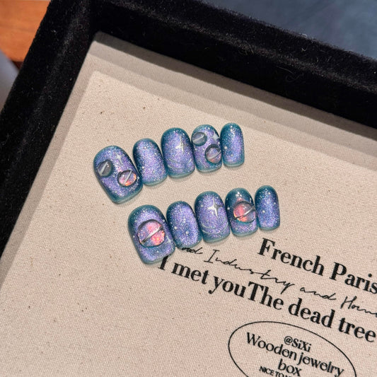 NLSJMP cosmic planet nails in blue and purple, bold everyday style.