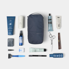 NOMATIC travel essential pouch helps keep toiletries organized for quick airport checks.