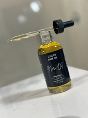 Nori Oil bottle pour with eight-oil blend for hair nourishment and fragrance