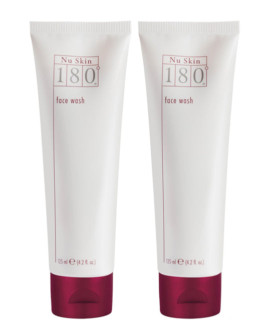 Nu Skin 180° Face Wash bottle pouring, suggesting a hydrating cleanse.