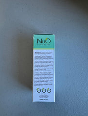 NuOrganic Perfect Eye Serum USA-made lab production seal shows quality control.