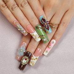 OCOUYVD rose art nails highlight 3D flower designs for weddings or special occasions.