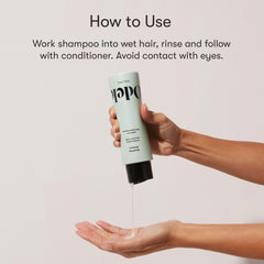 Odele smoothing shampoo on wet hair demonstrates even distribution and frizz smoothing