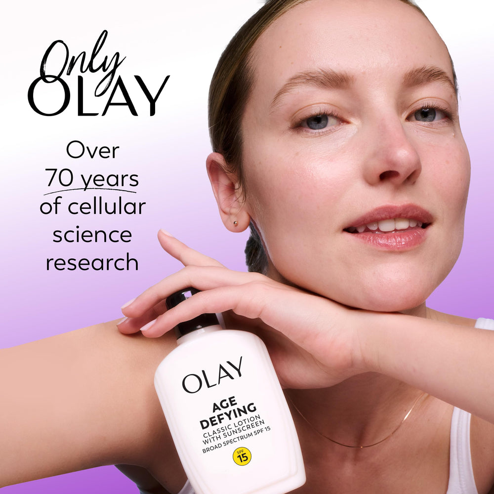 Olay Age Defying Classic bottle on bathroom shelf for daily routine.