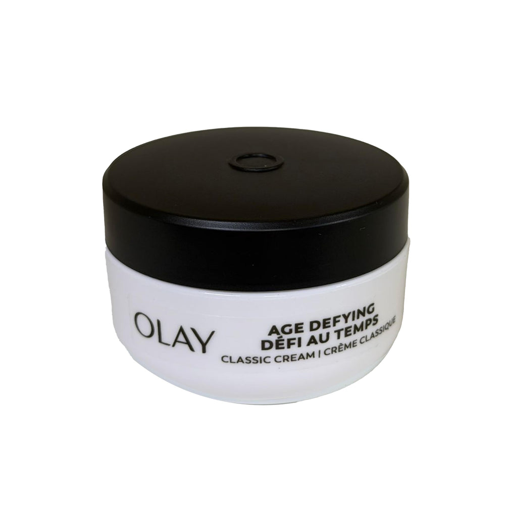 Olay Age Defying cream applying on cheek for refreshed look.